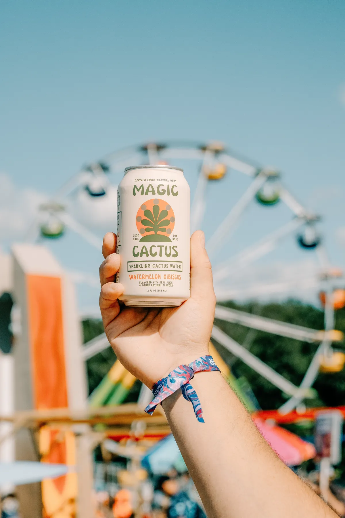 Magic Cactus sparkling h❋mp water enjoyed at a summer social moment